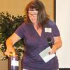 Natalie, daughter of Frances, lighting the remembrance candle