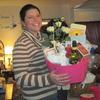 Sandy, daughter of Ellen, volunteering with the auction baskets for OMOM